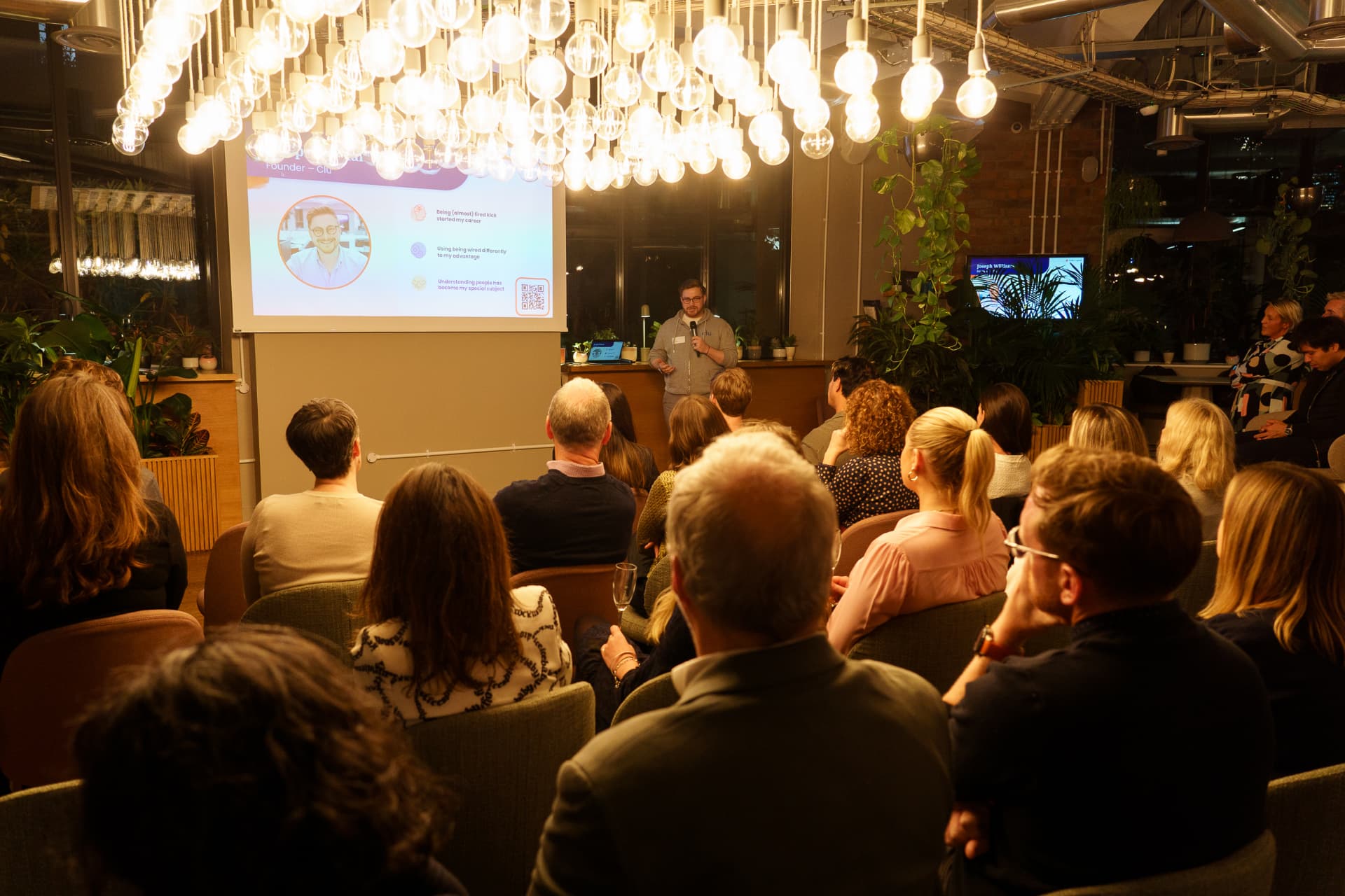 Audience watching a speaker at a NoBa Connect event.
